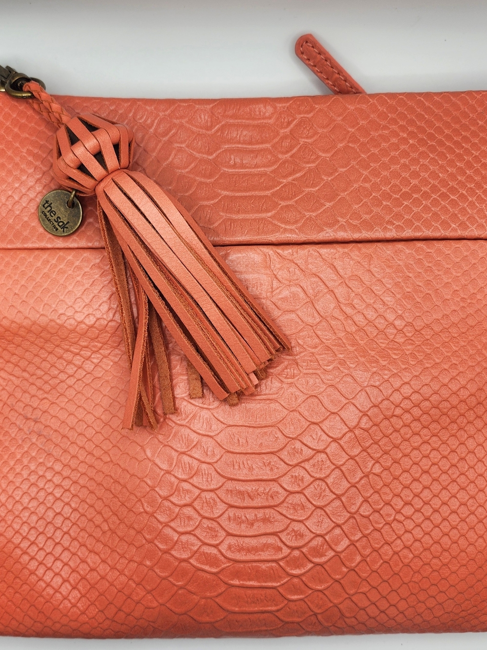 The Sak Coral Embossed Leather Tassel Wristlet